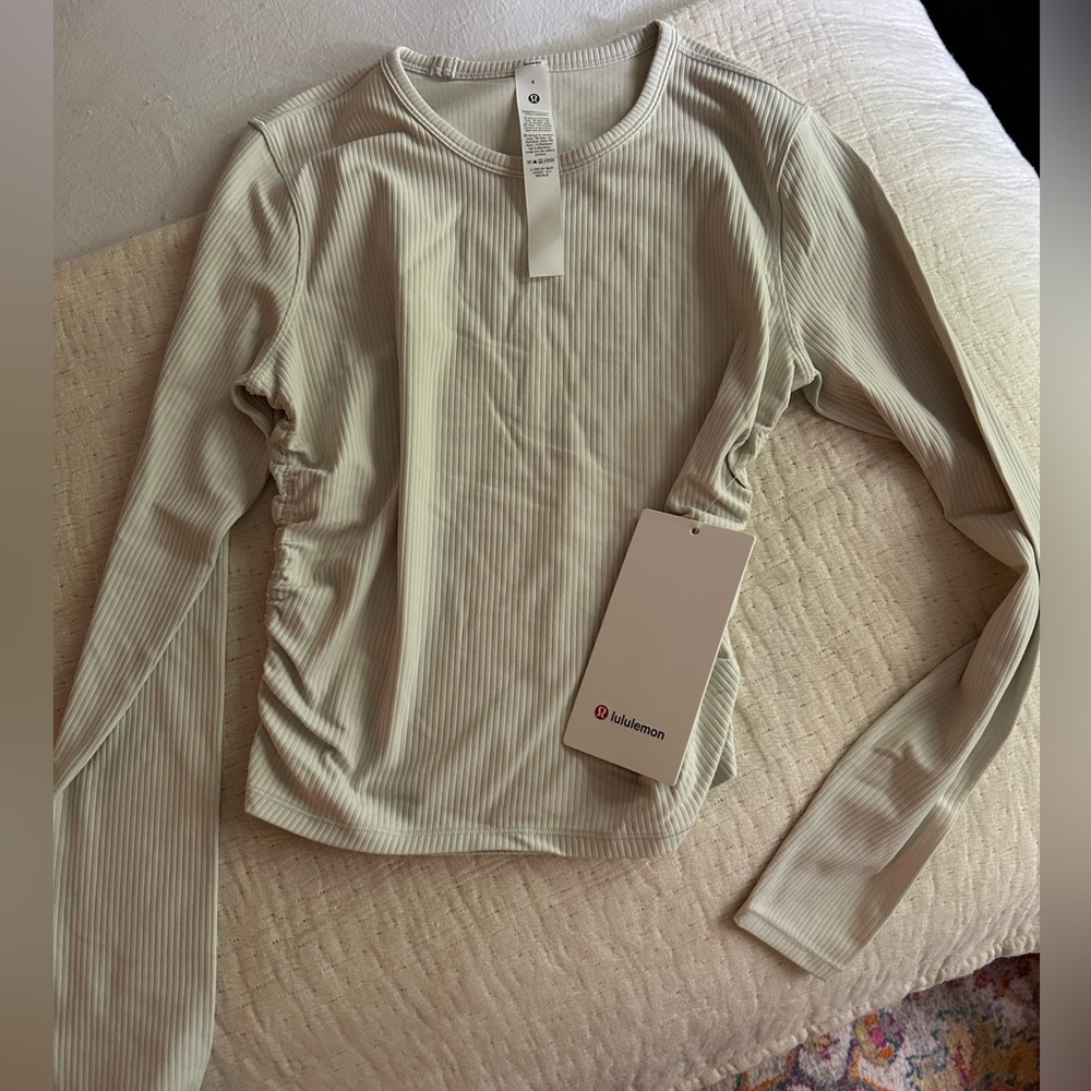 NWT. All it takes long sleeve Nulu. Color bone. Size 4